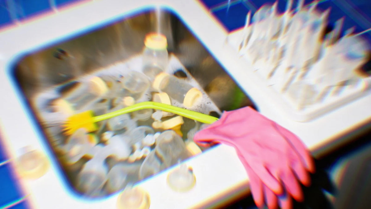 A blurred, cluttered sink full of bottle parts.
